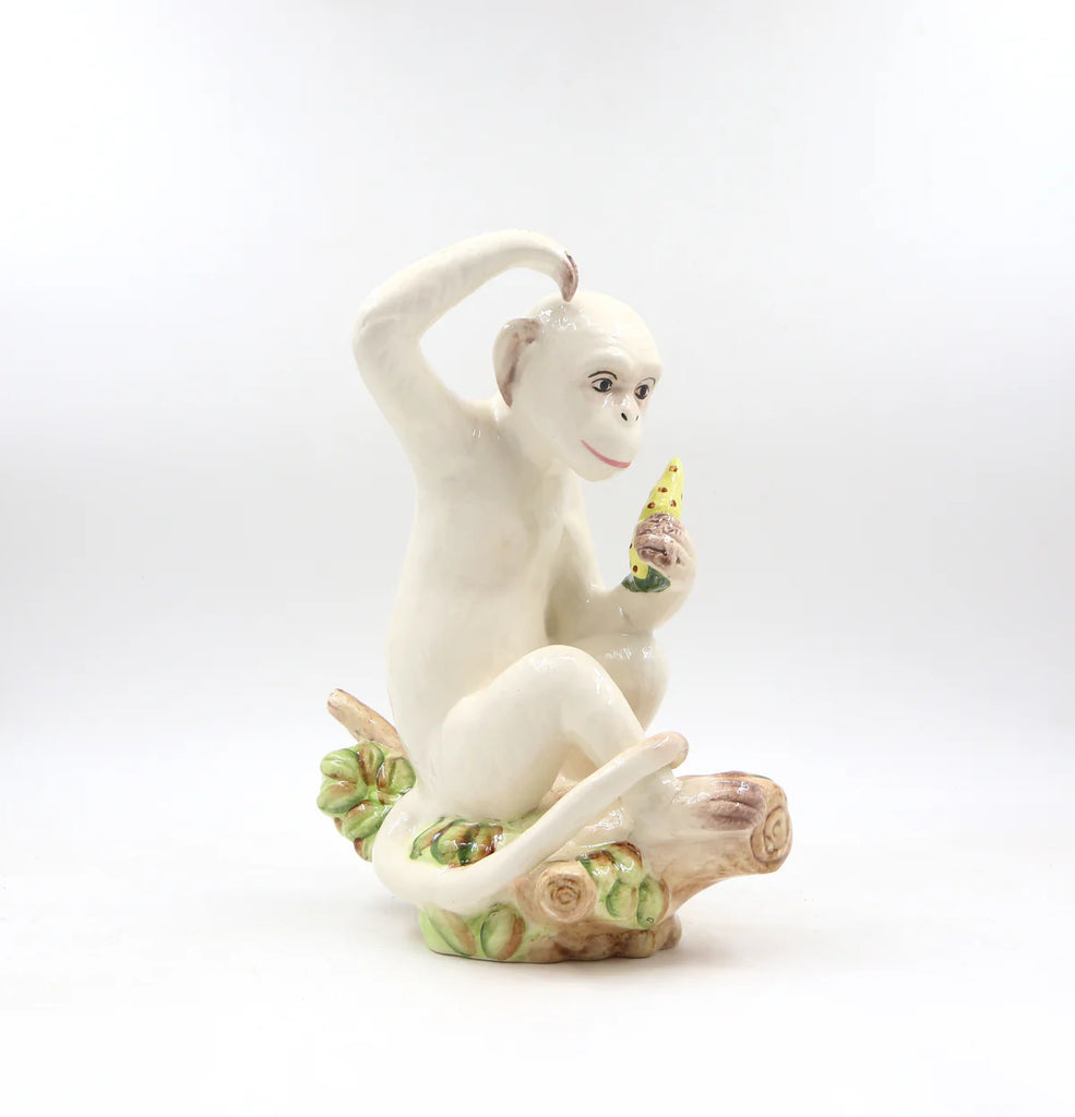 Handcrafted monkey figurine with lifelike details and expressive features.