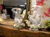 Set of 2 playful monkey sculptures styled on a shelf for a unique home décor accent.