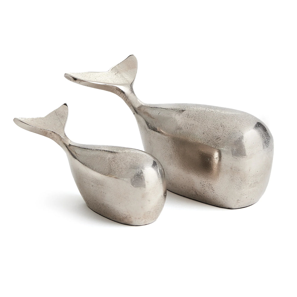 Set of two silver Moby Whale Sculptures with a sleek, coastal-inspired design.