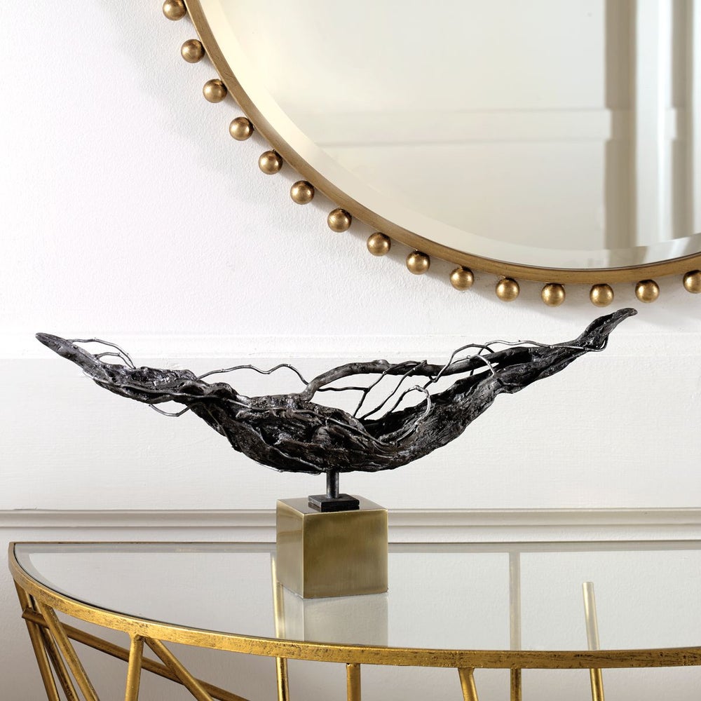 Tranquil Sculpture featuring a fluid, abstract design with a polished finish.