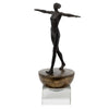 Woman Finding Balance sculpture, walking upright on the base with arms straight out to the sides.