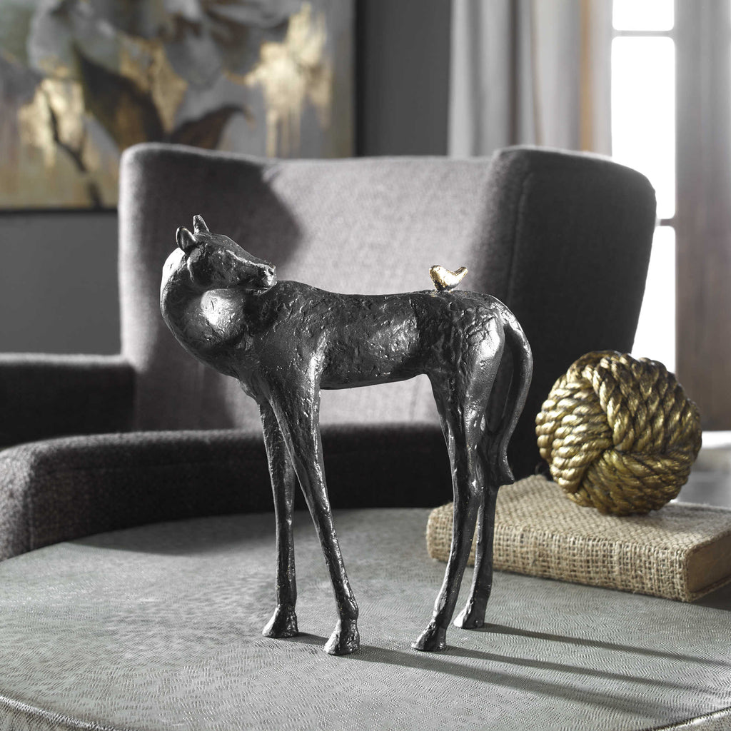 Hello Friend Horse Sculpture with a dark brown cast iron finish, light bronze tipping, and an antique gold bird.