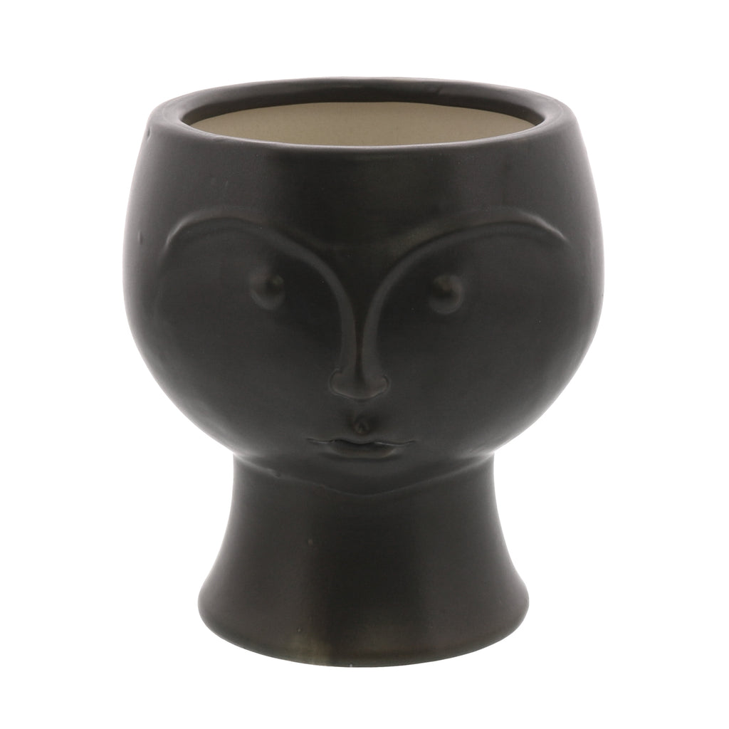 Detailed view of Rory Ceramic Face Vase, showcasing its simple and stoic facial features.